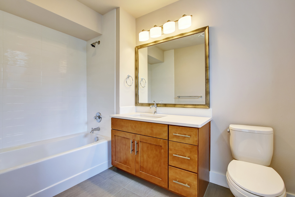 White tones and vanity cabinet.